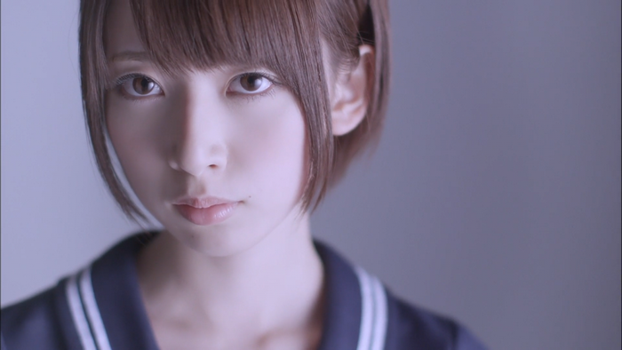 Portrait of a young woman with short brown hair