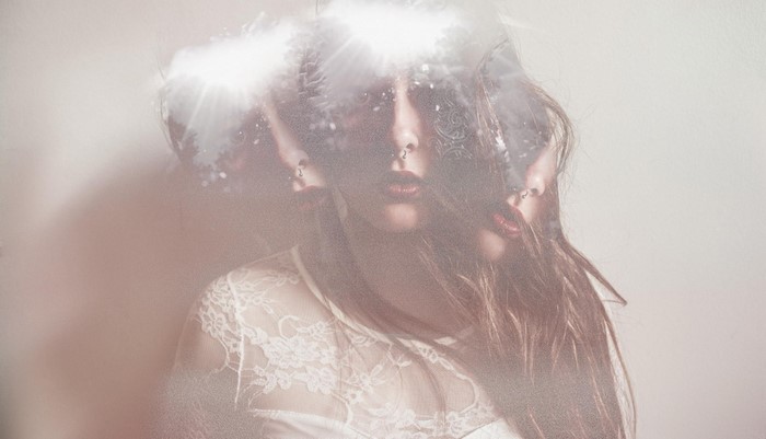 Woman with multiple exposures and lace dress