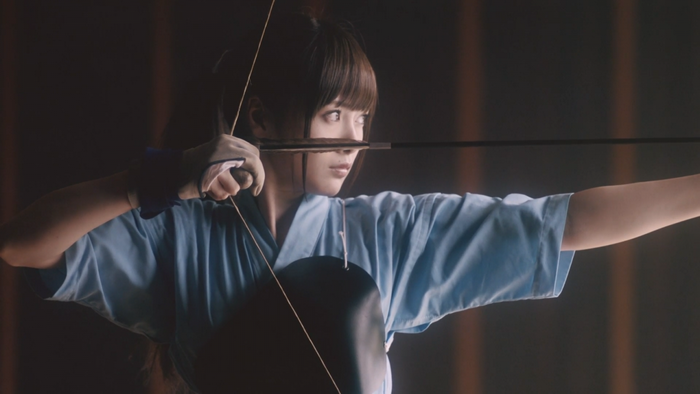 Nogizaka46 member performing archery