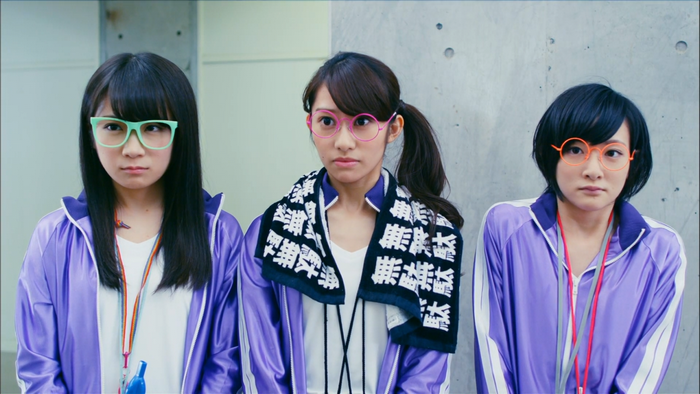 Three women in tracksuits and glasses