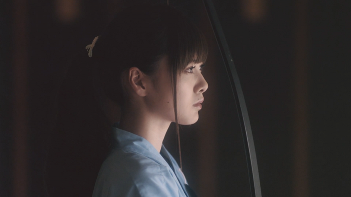Woman with ponytail in profile