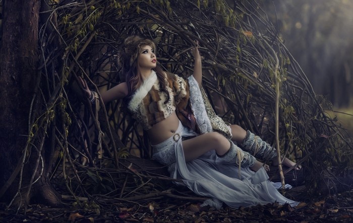 Woman in fantasy attire in a forest