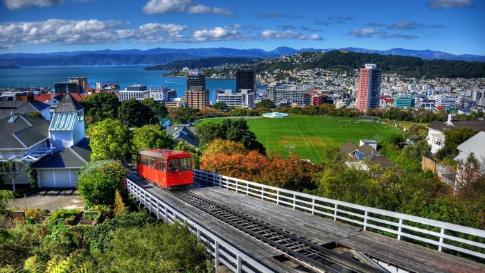 Wellington cityscape with red tram and harbor