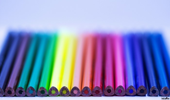 Macro photography of a rainbow line of colored pencils