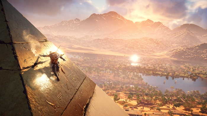 Bayek climbing a pyramid in Assassin's Creed Origins