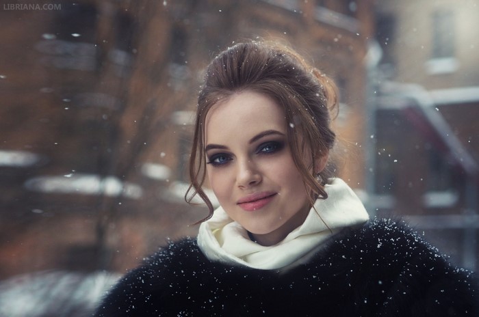 Winter Portrait of a Smiling Woman with Blue Eyes