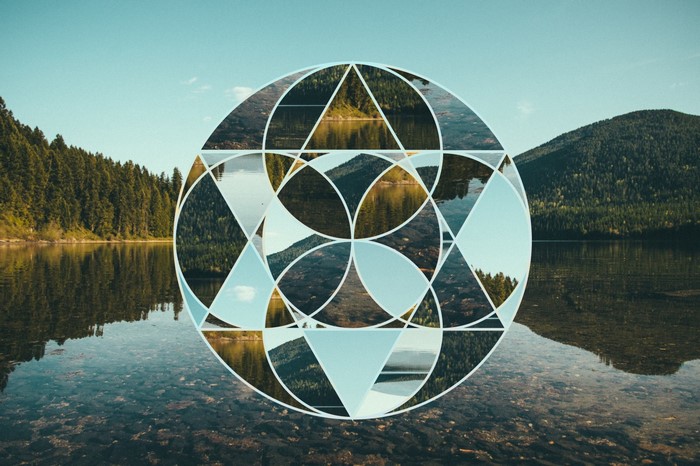 Geometric overlay on a lake and forest landscape