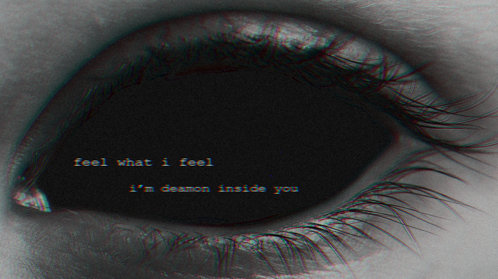 Close-up of a dark eye with text overlay
