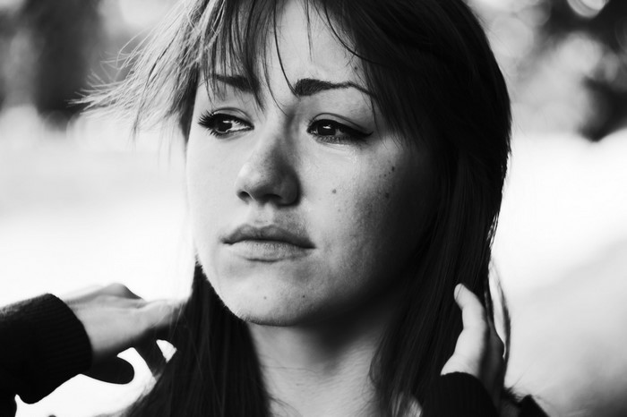 Monochrome portrait of a woman looking away
