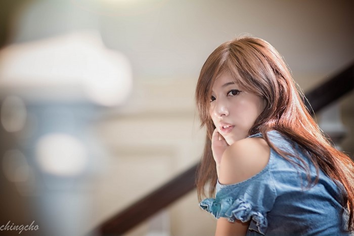 Portrait of a Woman with Brown Hair in Denim Dress