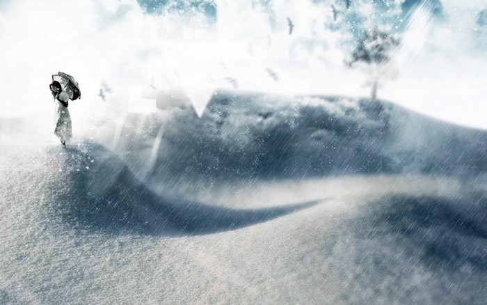 Girl with umbrella in a snowy landscape
