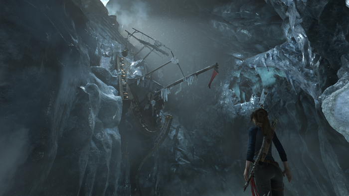 Lara Croft in a frozen cave with a shipwreck in Rise of the Tomb Raider