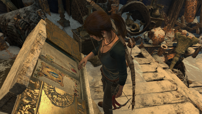 Lara Croft from Tomb Raider examining ancient text