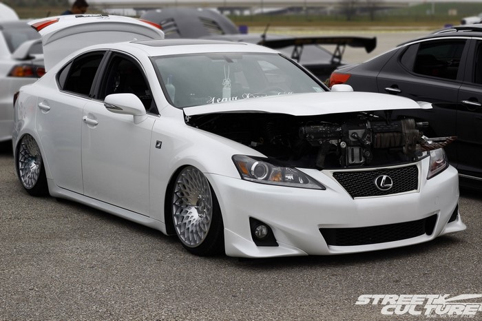 White Lexus IS F with custom rims and open hood
