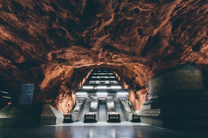 Stockholm Subway Station with Rock Formations and Escalators