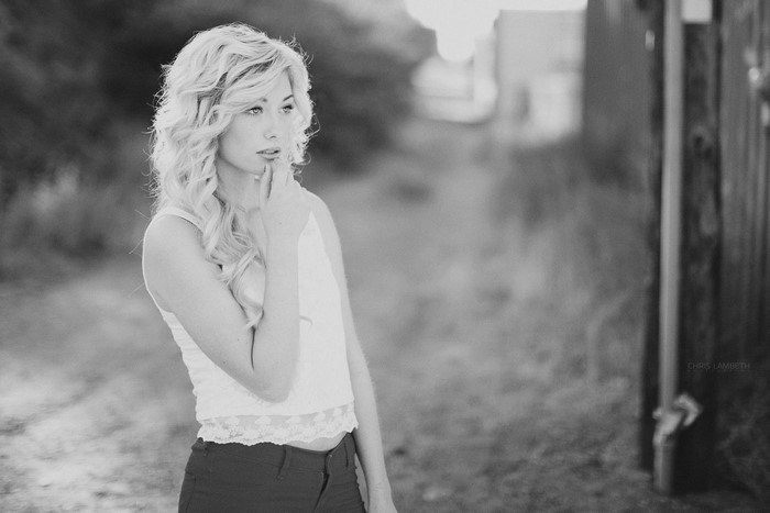 Monochrome portrait of a woman with blonde curly hair
