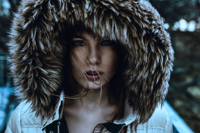 Woman with fur hood looking at viewer