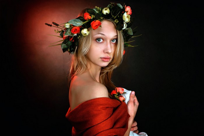 Woman with flower wreath and red shawl
