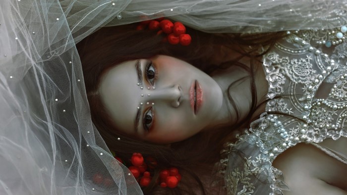 Woman with veil and red berries