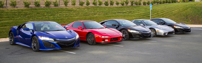 Acura NSX sports cars parked in a lot