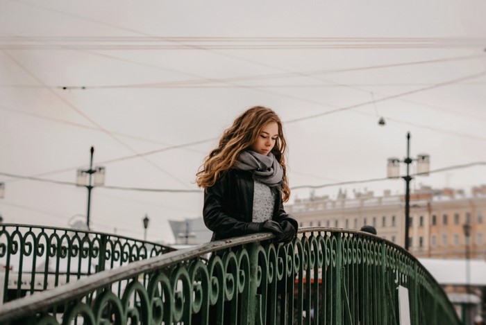 Woman on a bridge in winter