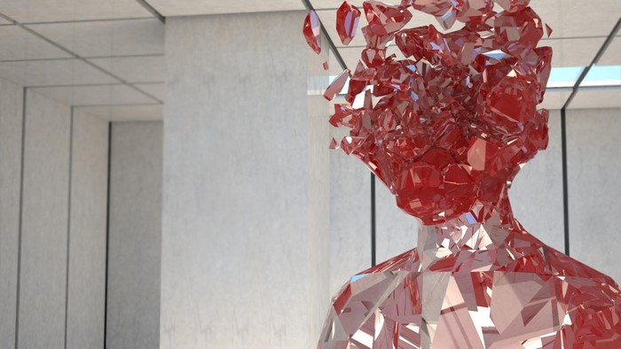 Red glass human sculpture in modern interior