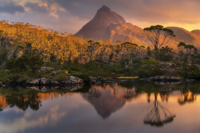 Mountain reflecting in a lake at sunset