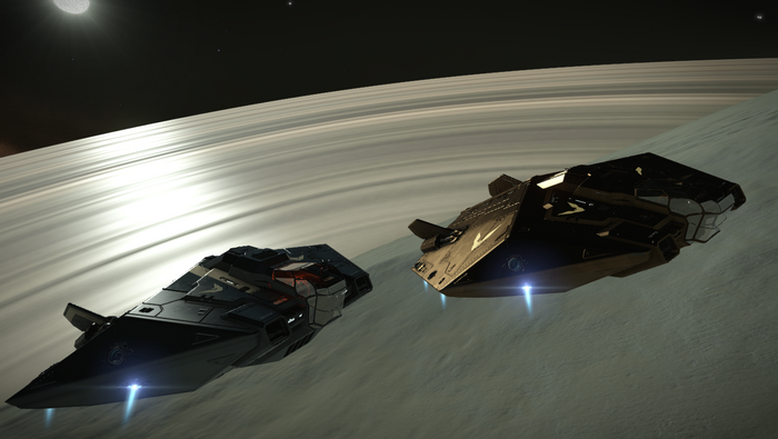 Two spaceships near a ringed planet in Elite Dangerous