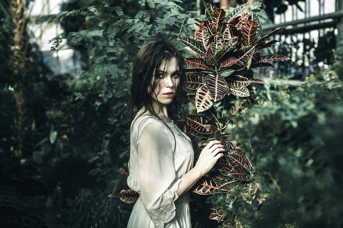 Woman in a dress in a botanical garden