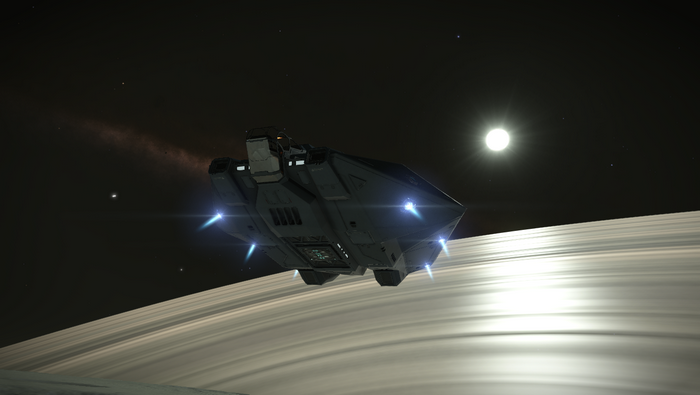 Elite Dangerous spaceship near planet rings