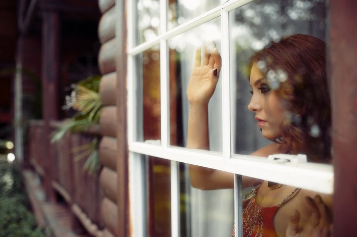Woman looking out a window