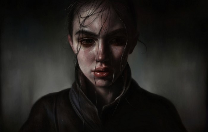 Portrait of a young woman in darkness
