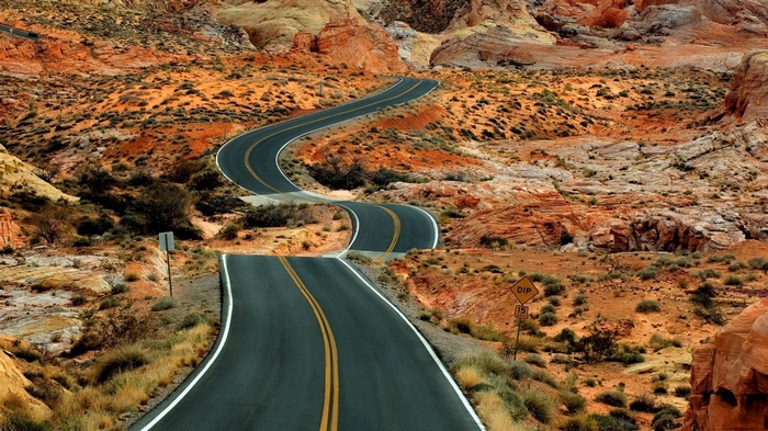 Winding road through desert landscape