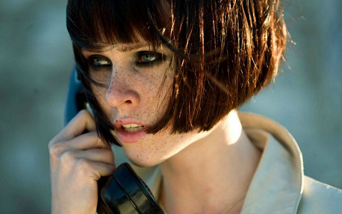 Natalya Rudakova as a woman with freckles on the phone