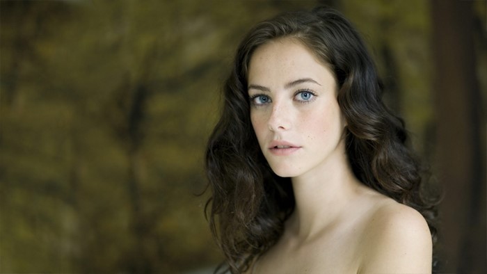 Kaya Scodelario portrait with blue eyes and brown hair