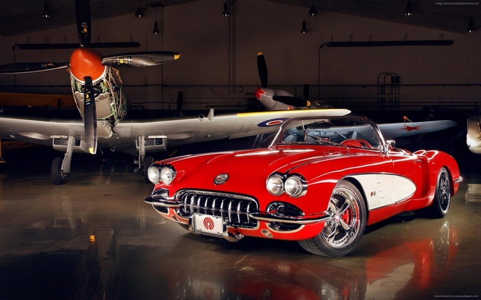 Red Chevrolet Corvette C1 with airplanes