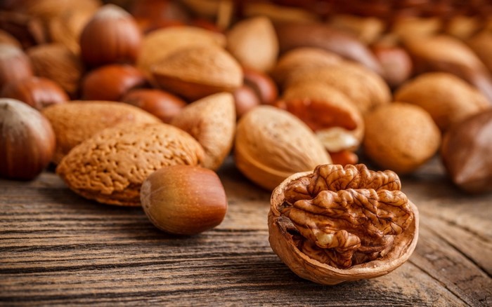 Assortment of nuts on a wooden surface