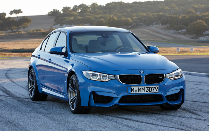 Blue BMW M3 Sedan on a Race Track