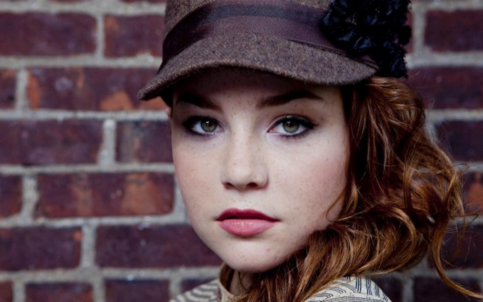 Portrait of Redhead Woman Wearing Brown Hat