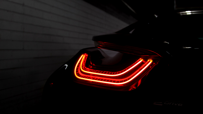 BMW i8 electric car taillight in darkness