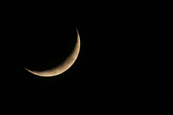 Crescent Moon in the Darkness