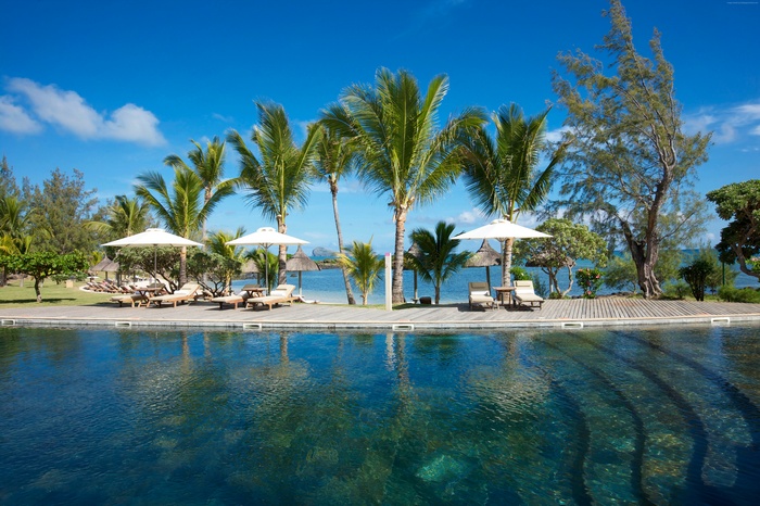 Infinity Pool and Beachfront Resort with Palm Trees in Mauritius