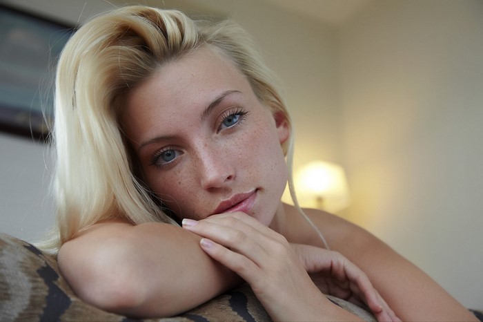 Blonde woman with blue eyes and freckles