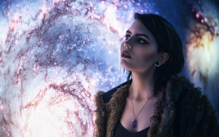 Woman looking at a galaxy