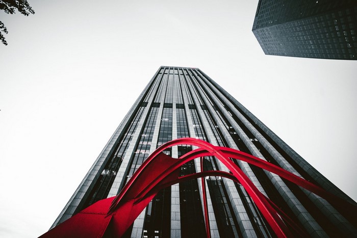 Red Sculpture in front of Skyscrapers