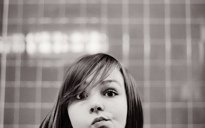 Monochrome portrait of a young girl making a face