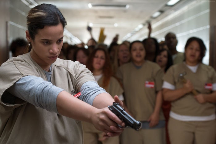 Dayanara Diaz from Orange Is the New Black with a gun