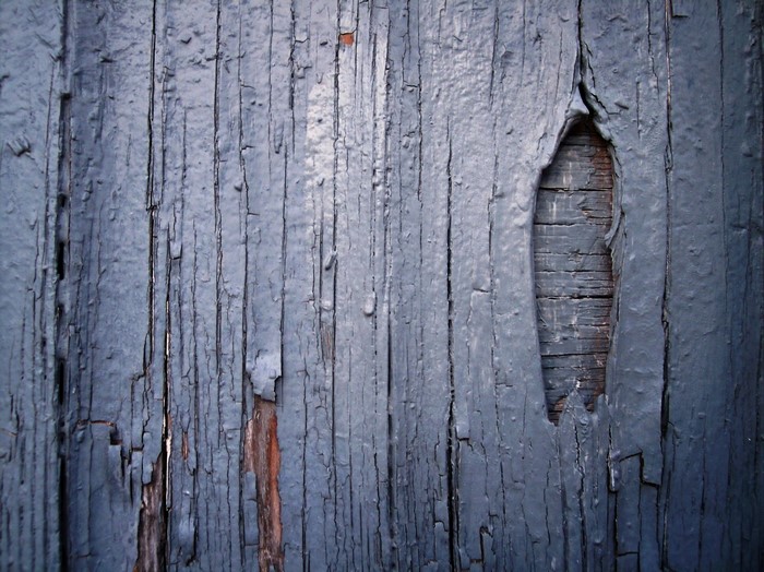Cracked blue painted wooden planks texture