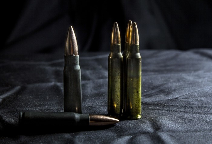 Ammunition on a dark fabric surface