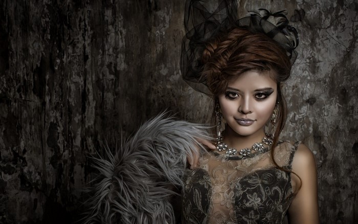 Asian woman with elaborate hairstyle and makeup